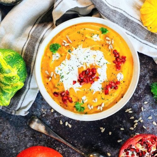 moroccan soup with carrots lentils coconut cream pomegranate and orange color and spice